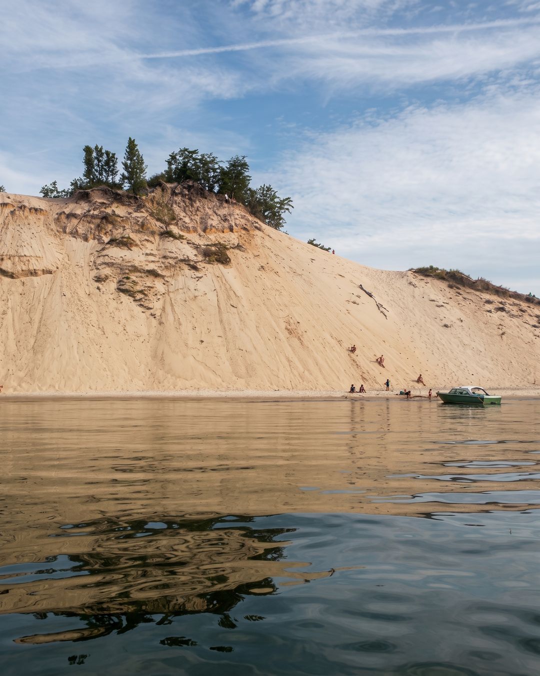 A sand dune rising straight out of Lake Michigan at Indiana Dunes