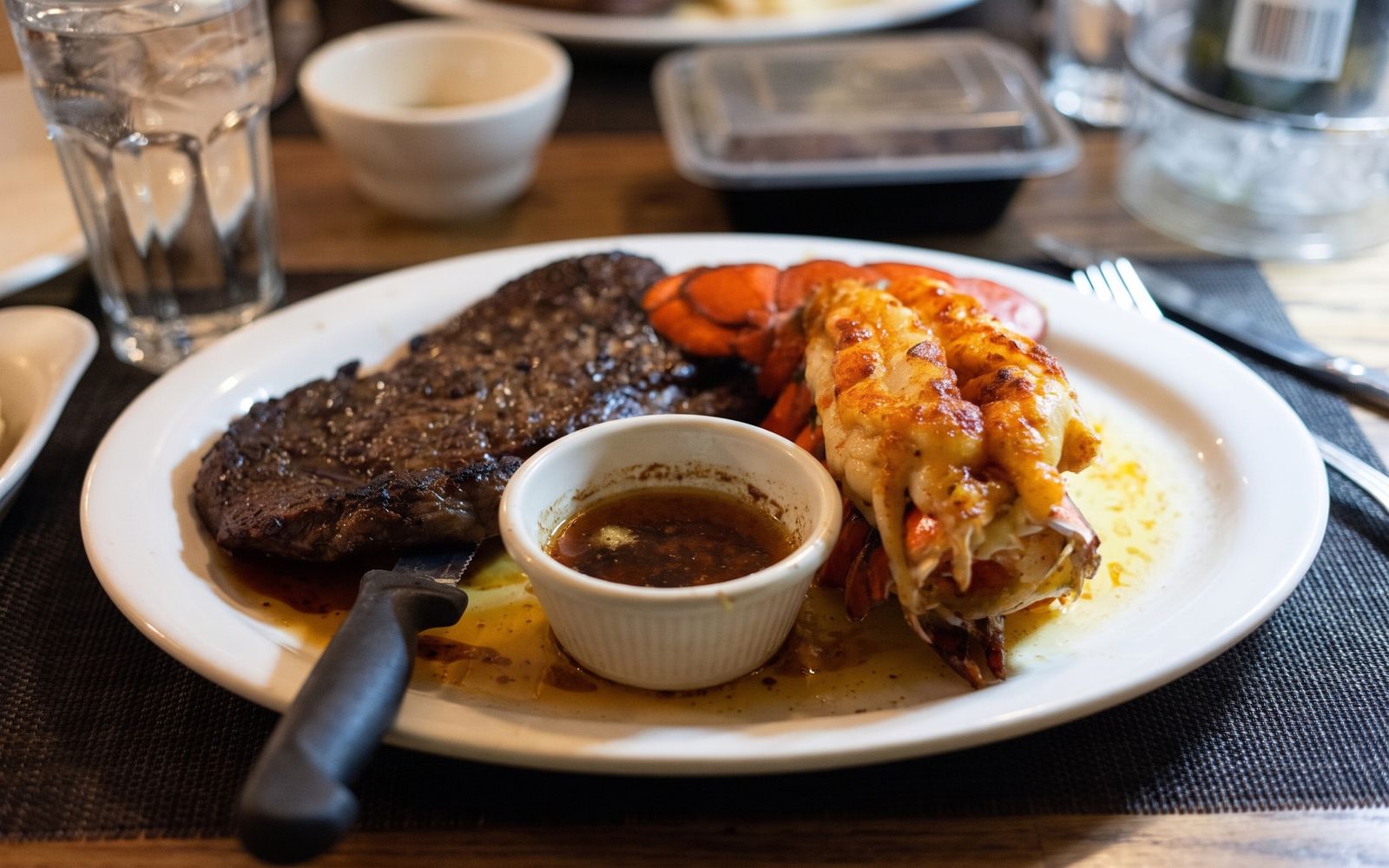 Steak and a broiled lobster tail with drawn butter at Keith's