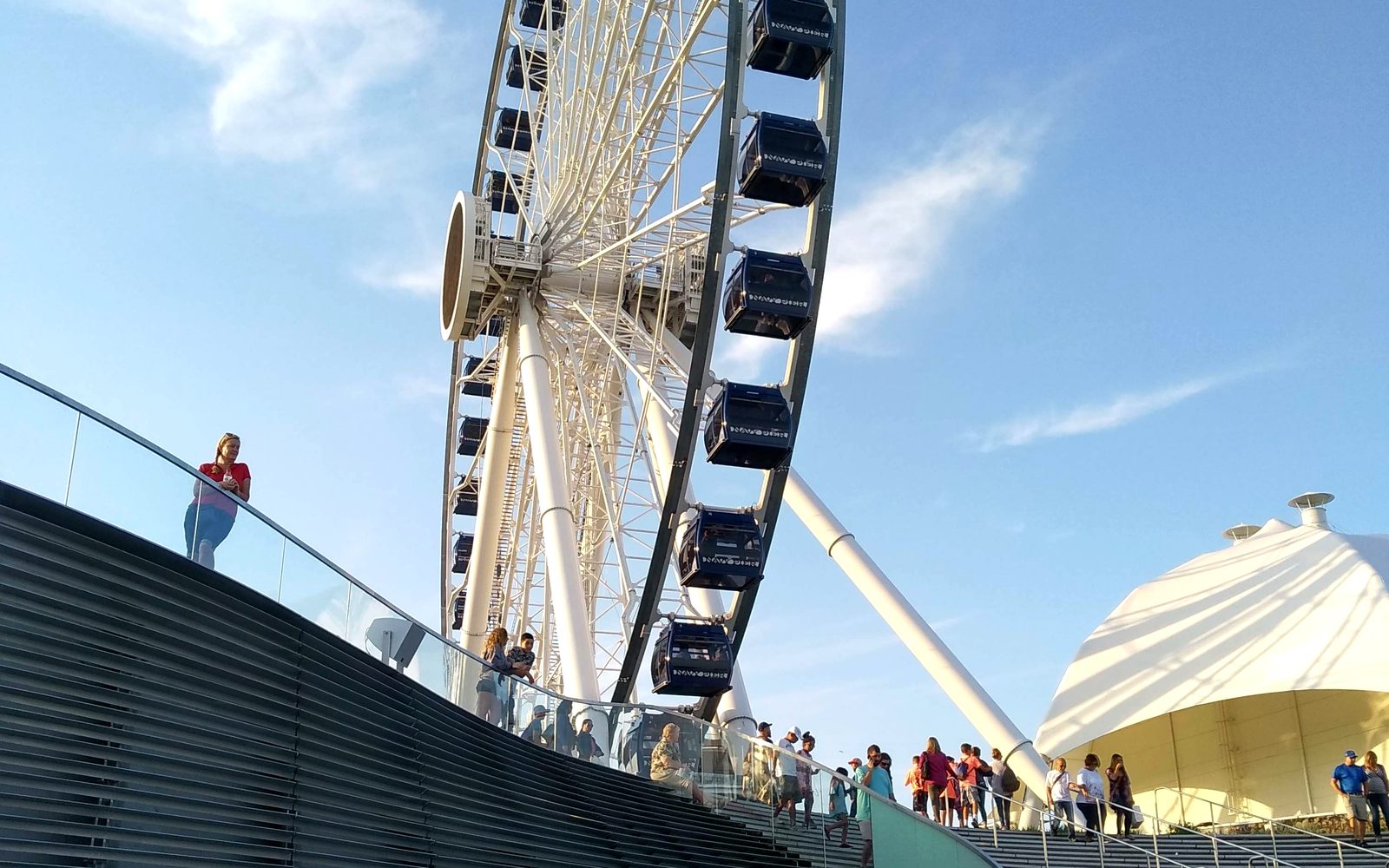 The Centennial Wheel turning above the crowds on Navy Pier