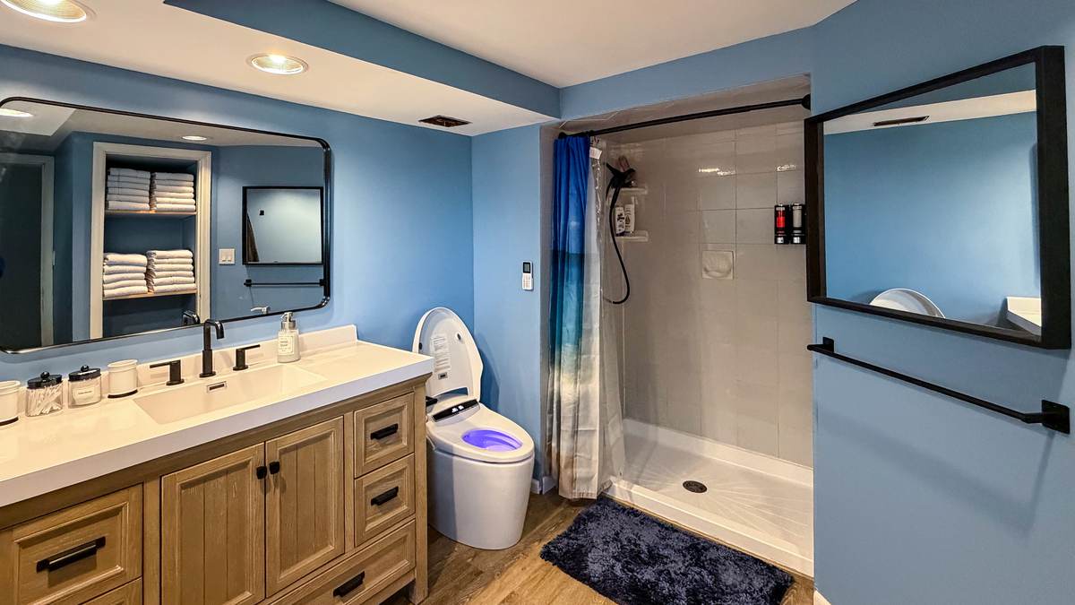 Full bathroom with walk-in shower and heated bidet