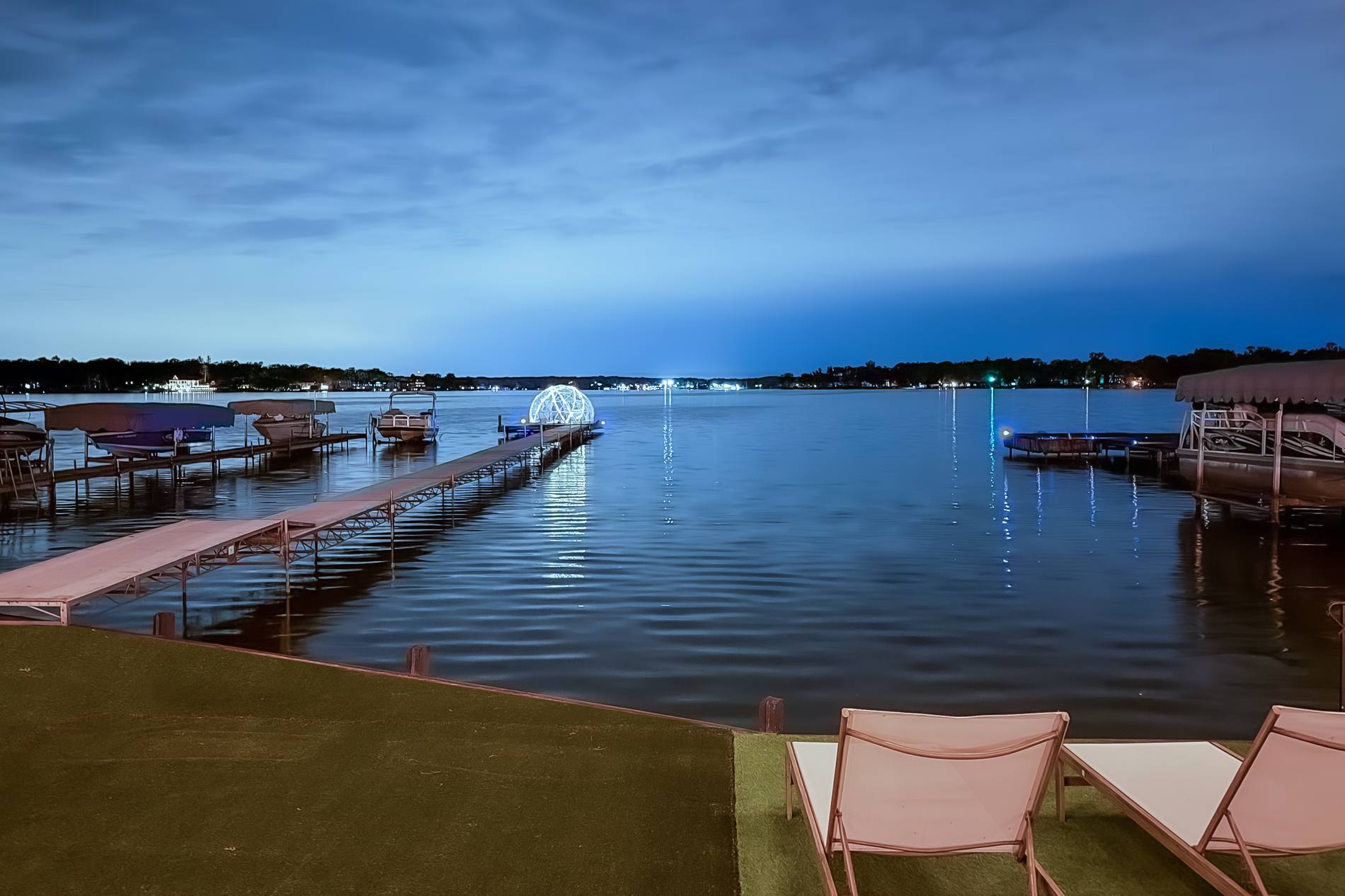 Cedar Lake at blue hour, the lit star-gazing dome on the pier