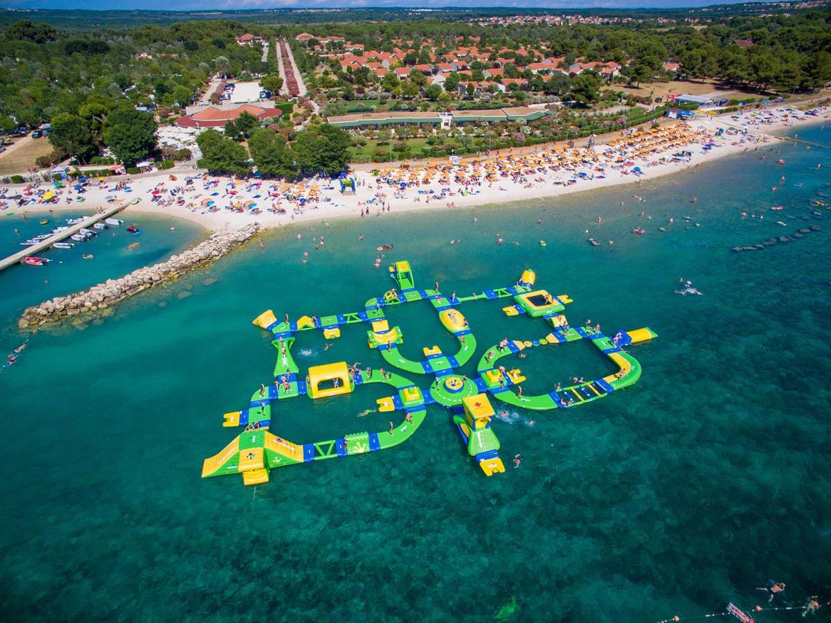 Aerial view of Whihala Beach and the WhoaZone inflatable water park on Lake Michigan, a short walk from the house