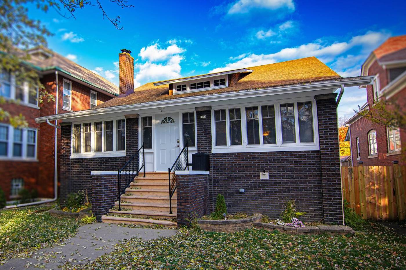 The Fun House front exterior on a tree-lined Whiting block